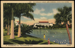Picturesque Mirror Lake, Showing Junior High School. St. Petersburg, Florida "The Sunshine City". by Hampton Dunn