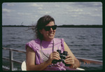 Debbie Butts binoculars on boat by Hillsborough County ELAPP