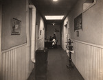 Hallway in Dr. Gavilla Children's Hospital with a nurse station