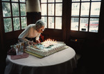 Helen Cruickshank blows out her birthday candles, 1994 by Unknown