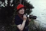 Helen Cruickshank holds a camera while bird watching by Jon Ellis