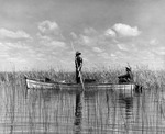 Two men on Lake Okeechobee near Kings Bay by Allan D. Cruickshank