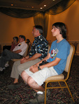 Seated Florida Ornithological Society (FOS) members listen to a speaker from the back row during a Board of Directors meeting in Mount Dora
