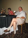 A Florida Ornithological Society (FOS) member raises his coffee mug during a Board of Directors meeting