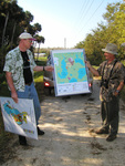 Two Florida Ornithological Society (FOS) members observe a map of marsh area in Leesburg during a birding trip by Florida Ornithological Society