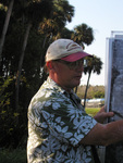Florida Ornithological Society (FOS) member rearranges a series of maps and aerial images in Leesburg, Florida
