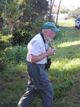 Florida Ornithological Society (FOS) President Jack Hailman scopes the ground with his camera in hand, Leesburg, Florida by Florida Ornithological Society