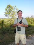 Dot Freeman smiles with his camera and binoculars in hand, Leesburg, Florida