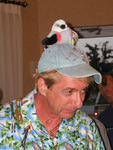 Former Florida Ornithological Society (FOS) president Bruce Anderson stands with a stuffed scissor-tailed flycatcher perched on his head, Mount Dora, Florida by Florida Ornithological Society