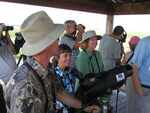 Florida Ornithological Society (FOS) members observe through cameras and binoculars during a birding trip, Leesburg, Florida