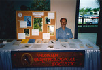 President Fred Lohrer works a Florida Ornithological Society (FOS) exhibit at the 1994 National Audubon Society Convention in Fort Myers by Reed Bowman