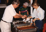John Fitzpatrick serves barbecue to Molly during a Florida Ornithological Society (FOS) meeting at Archbold Biological Station