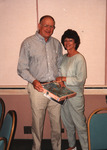 Glen and Jan Woolfenden pose with a bird-themed puzzle at the Florida Ornithological Society (FOS) 1994 spring meeting in West Palm Beach by Florida Ornithological Society