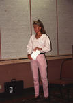 Camille Sewell stands with a stack of papers during the Florida Ornithological Society (FOS) 1994 meeting in West Palm Beach