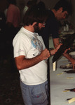 Eugene Stoccardo studies a bird skin closely during the Florida Ornithological Society (FOS) 1994 spring meeting in West Palm Beach