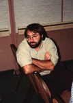 Eugene Stoccardo poses against the back of his chair at the Florida Ornithological Society (FOS) 1994 meeting in West Palm Beach