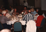 Sheila Mahoney and Herb Kale sit at a crowded table at the Florida Ornithological Society (FOS) 1994 spring meeting in West Palm Beach