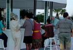 Florida Ornithological Society (FOS) members stand at the bar during the 1995 fall meeting in Cocoa Beach