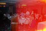 Florida Ornithological Society (FOS) members eat and mingle in a large ballroom during the 1995 fall meeting in Cocoa Beach
