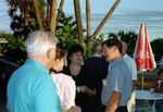 Four Florida Ornithological Society (FOS) members chat outside during the 1995 fall meeting in Cocoa Beach