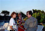 Three Florida Ornithological Society (FOS) members chat by the pool during the 1995 fall meeting in Cocoa Beach