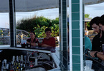 Florida Ornithological Society (FOS) members sit at the bar on an outdoor deck during the 1995 fall meeting in Cocoa Beach