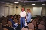 Ted Below speaks with two other Florida Ornithological Society members during a meeting in Jacksonville, Florida