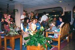 A sitting room of Florida Ornithological Society members and children chat during a meeting in Jacksonville, Florida