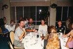 Wes Biggs, Pam Bowen, and five other Florida Ornithological Society members sit at a dinner table during a meeting in Jacksonville, Florida