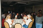 Florida Ornithological Society members fill a banquet room sitting at many round dinner tables during a meeting in Jacksonville, Florida