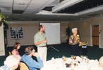 Audience members look on while Peggy Powell gives a speech during a Florida Ornithological Society meeting in Jacksonville, Florida