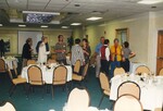 A cluster of 10 Florida Ornithological Society members stand chatting following a meeting in Jacksonville, Florida