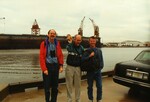 Peter Merritt, Frank Lohrer, and Todd Engstrom laugh mid-photo in front of the Port of Tampa