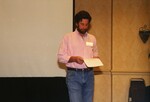Reed Bowman consults his notes while speaking at a Florida Ornithological Society meeting in Tampa, Florida