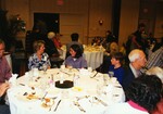 A table of adults and children chat during a Florida Ornithological Society meeting in Tampa, Florida
