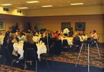 A banquet hall of Florida Ornithological Society members dines beside a projector during a meeting in Tampa, Florida