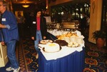 A guest smiles from behind a buffet table during a Florida Ornithological Society meeting in Tampa, Florida