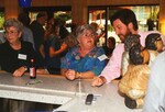 Marie Slaney and Reed Bowman sit at the bar during a Florida Ornithological Society meeting in Tampa, Florida