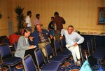 Glenn Woolfenden and John Fitzpatrick speak to someone during a Florida Ornithological Society meeting in Tampa, Florida
