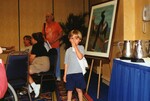 A child holds a napkin to his face during a Florida Ornithological Society meeting in Tampa, Florida