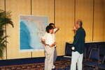 Fred Lohrer speaks with two other guests at a Florida Ornithological Society meeting in Tampa, Florida