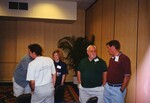 Five Florida Ornithological Society members chat during a meeting in Tampa, Florida