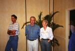 Jim Cox and two others stand to the side of the room at a Florida Ornithological Society meeting in Tampa, Florida