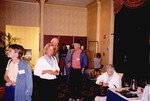 John Douglas, Dave Breininger, and three others chat among themselves during a meeting in Tampa, Florida