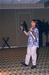 Andy Kratter presents with a bird skin and its feathers in his hand during a Florida Ornithological Society meeting in Gainesville, Florida