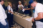Mary Davidson and other Florida Ornithological Society members take notes on bird skins at a meeting in Gainesville, Florida