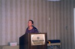 A presenter in a purple blouse speaks during a Florida Ornithological Society meeting in Gainesville, Florida