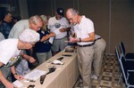 Fred Lohrer and other Florida Ornithological Society members take notes on bird skins at a meeting in Gainesville, Florida