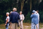 A Florida Ornithological Society group pays close attention during a birdwatching trip in Gainesville, Florida