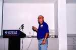 Buck Cooper speaks at a University of Florida podium during a Florida Ornithological Society meeting in Gainesville, Florida